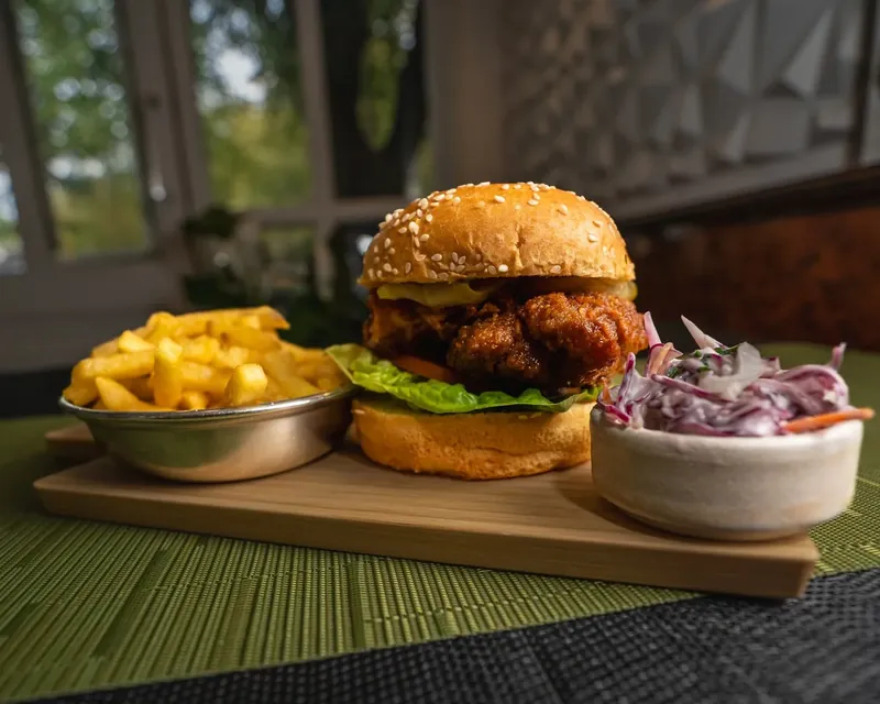 Buttermilk chicken burger with fries and coleslaw at Olive & Oak
